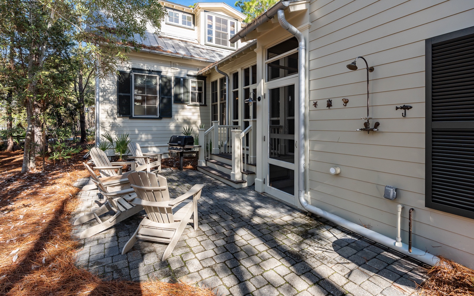 Relax in comfortable Adirondack chairs on your private patio, perfect for morning coffee or evening conversations under the trees.