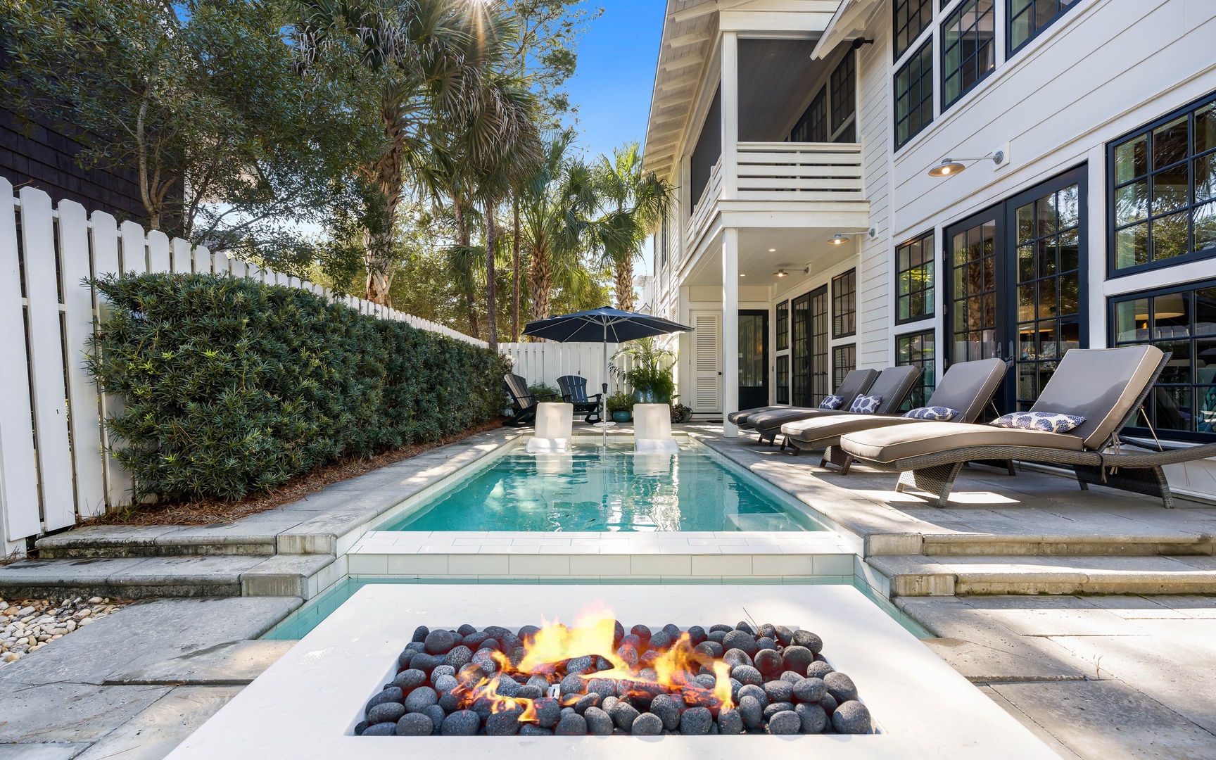 Dive into your private pool then warm up by the fire pit while lounging poolside under swaying palms.