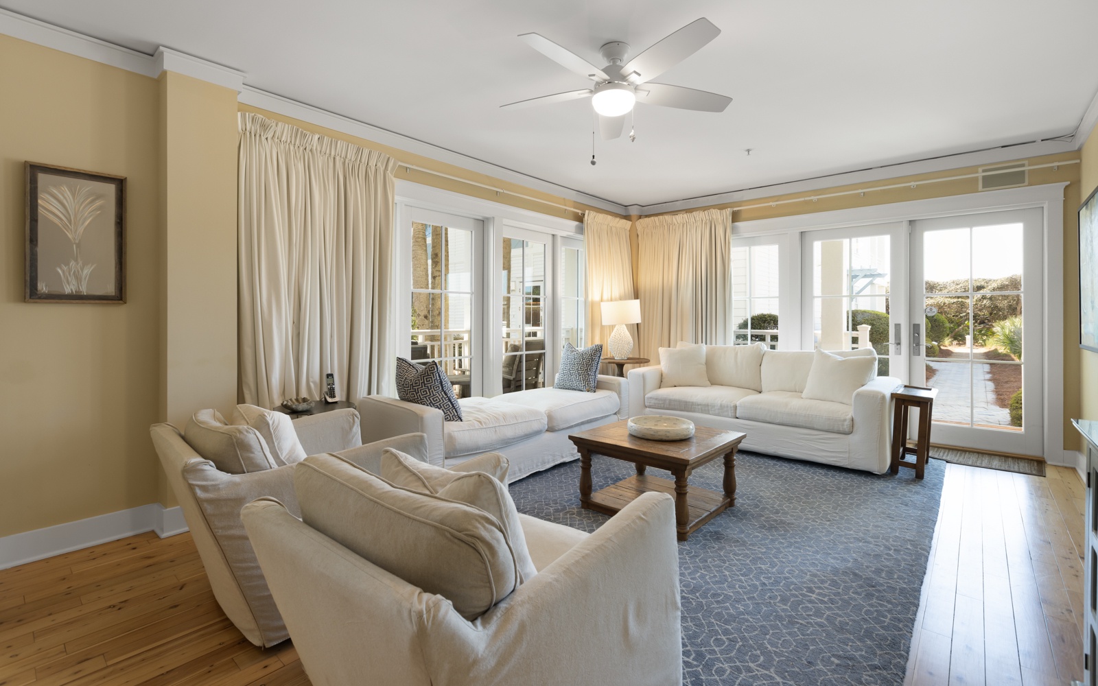 Sink into plush seating in this bright living room where French doors open to your outdoor space.