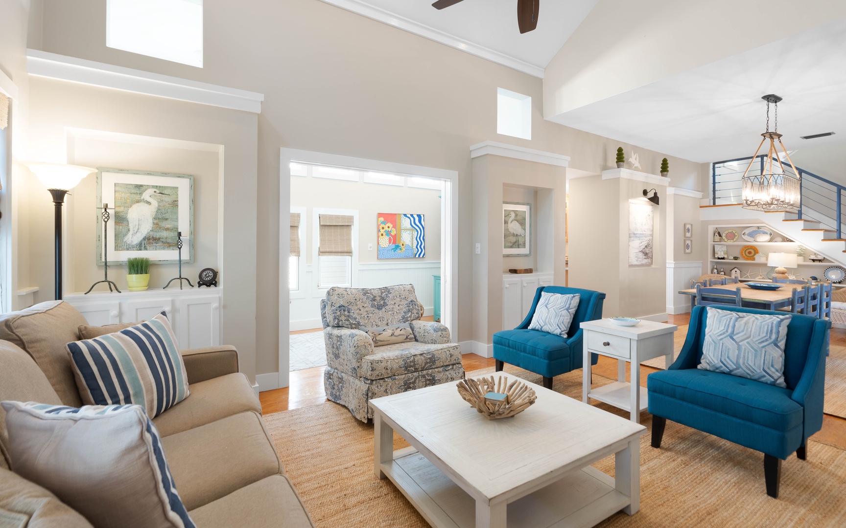 Sink into coastal comfort in your stylish living area, where teal accents and nautical touches create the perfect seaside retreat.