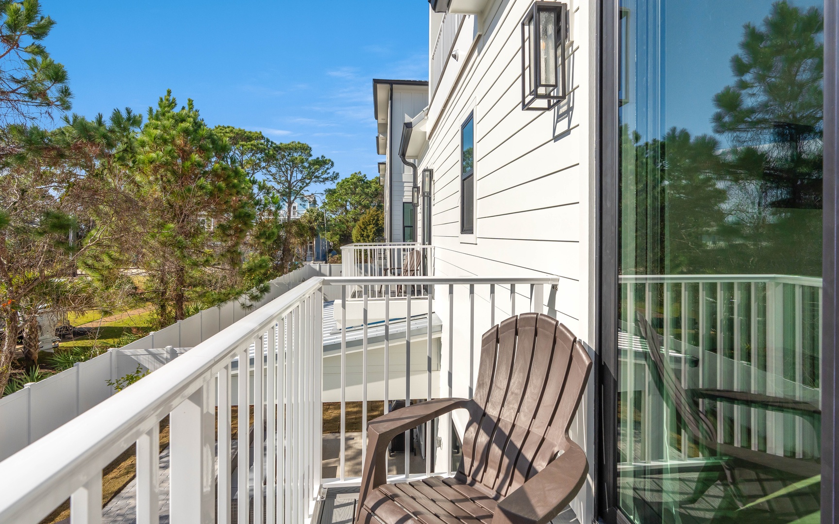 Step onto your private balcony and sink into the comfortable chair, breathing in fresh air while gazing at peaceful treetops.
