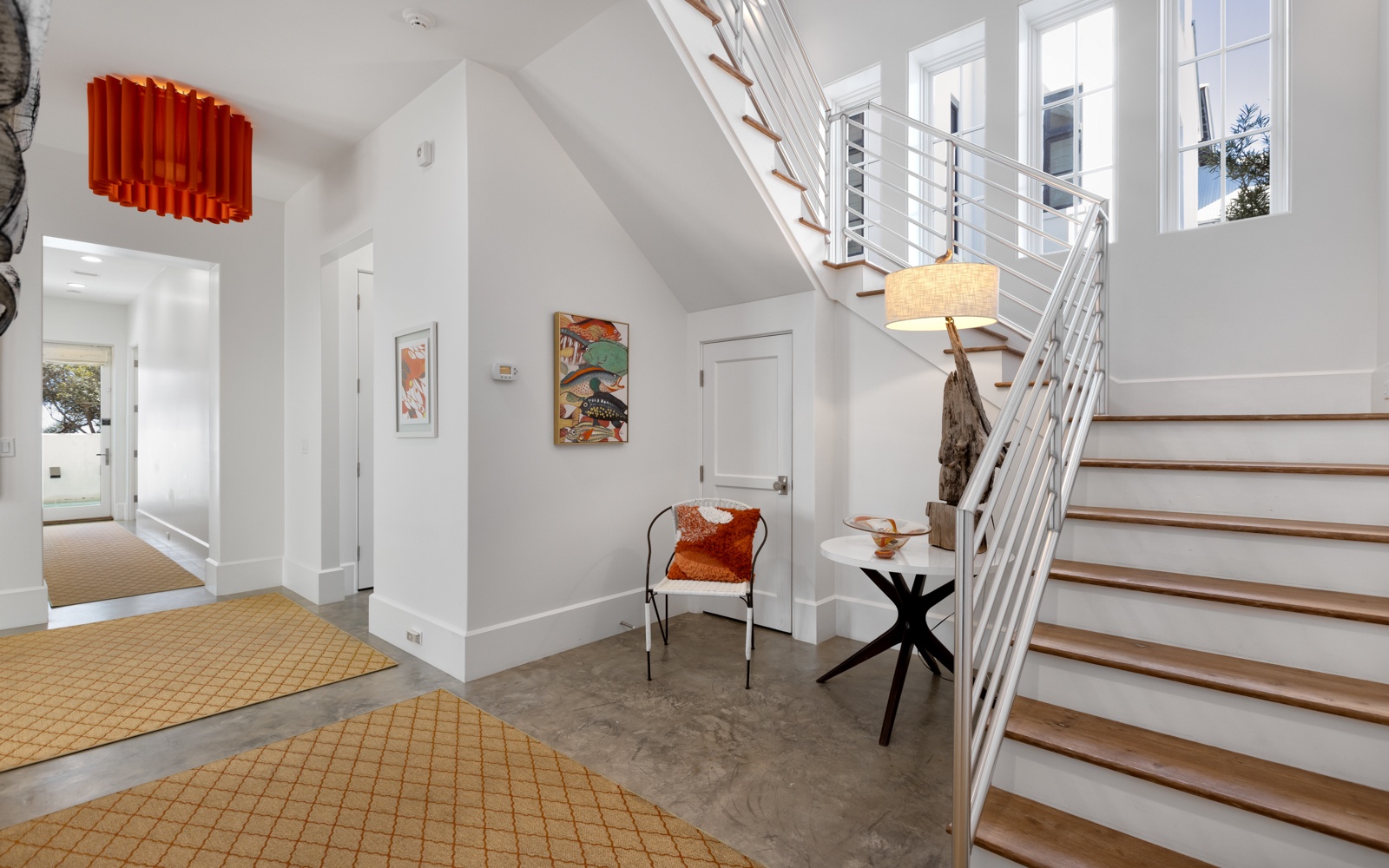 Step into your bright, airy entryway where artistic touches and modern design create the perfect welcome home feeling.