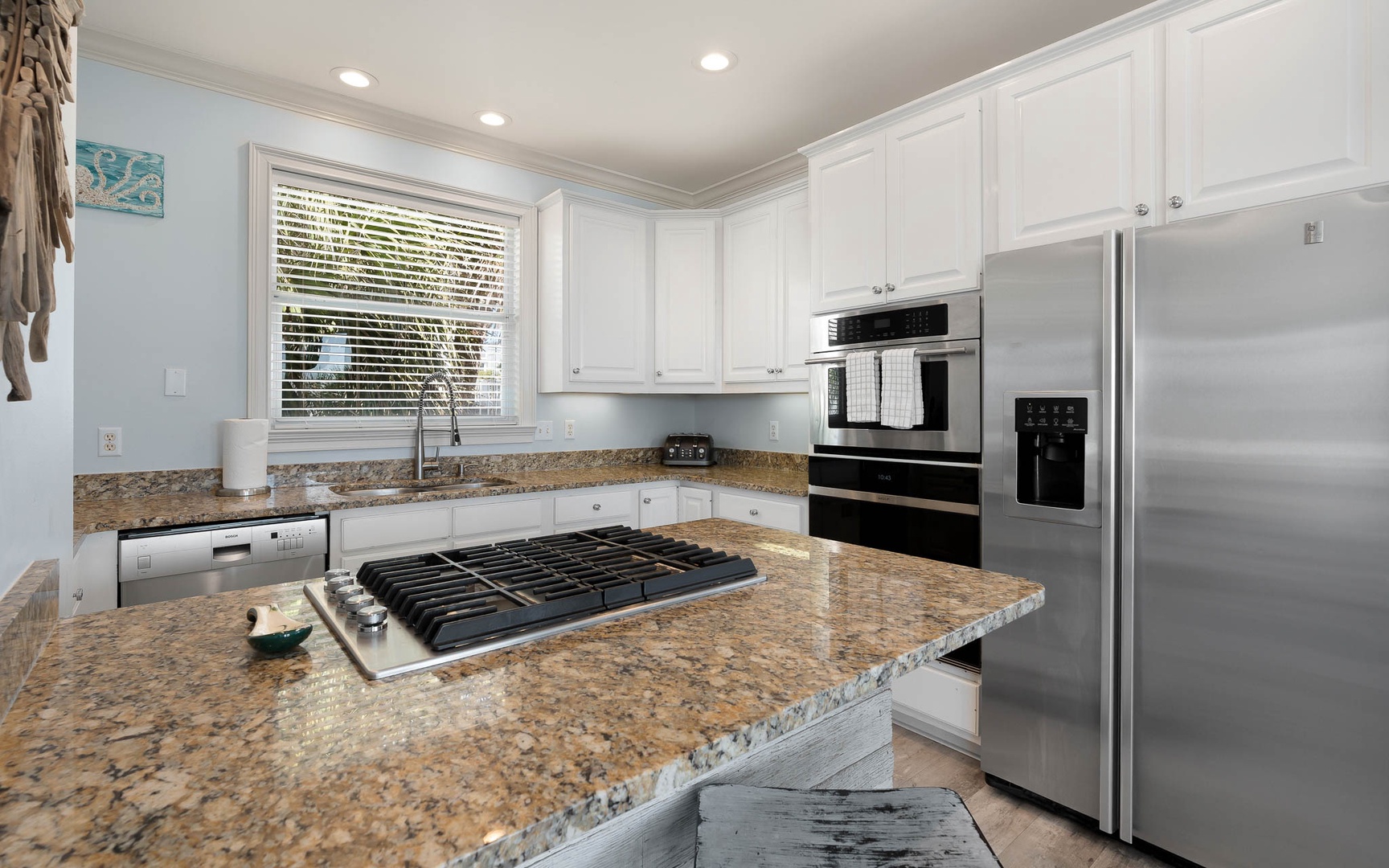 Your fully equipped kitchen features granite countertops, stainless steel appliances, and everything you need to create memorable meals during your stay.