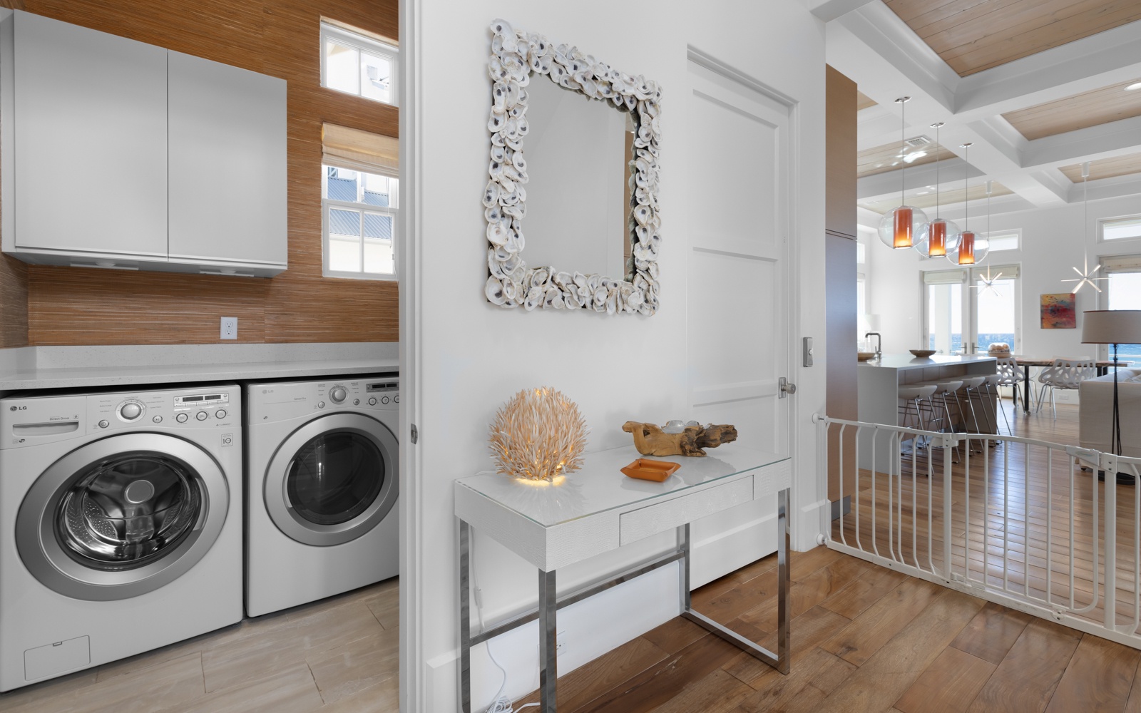 Your private laundry nook makes staying fresh effortless, while the stylish hallway leads to your open living spaces.