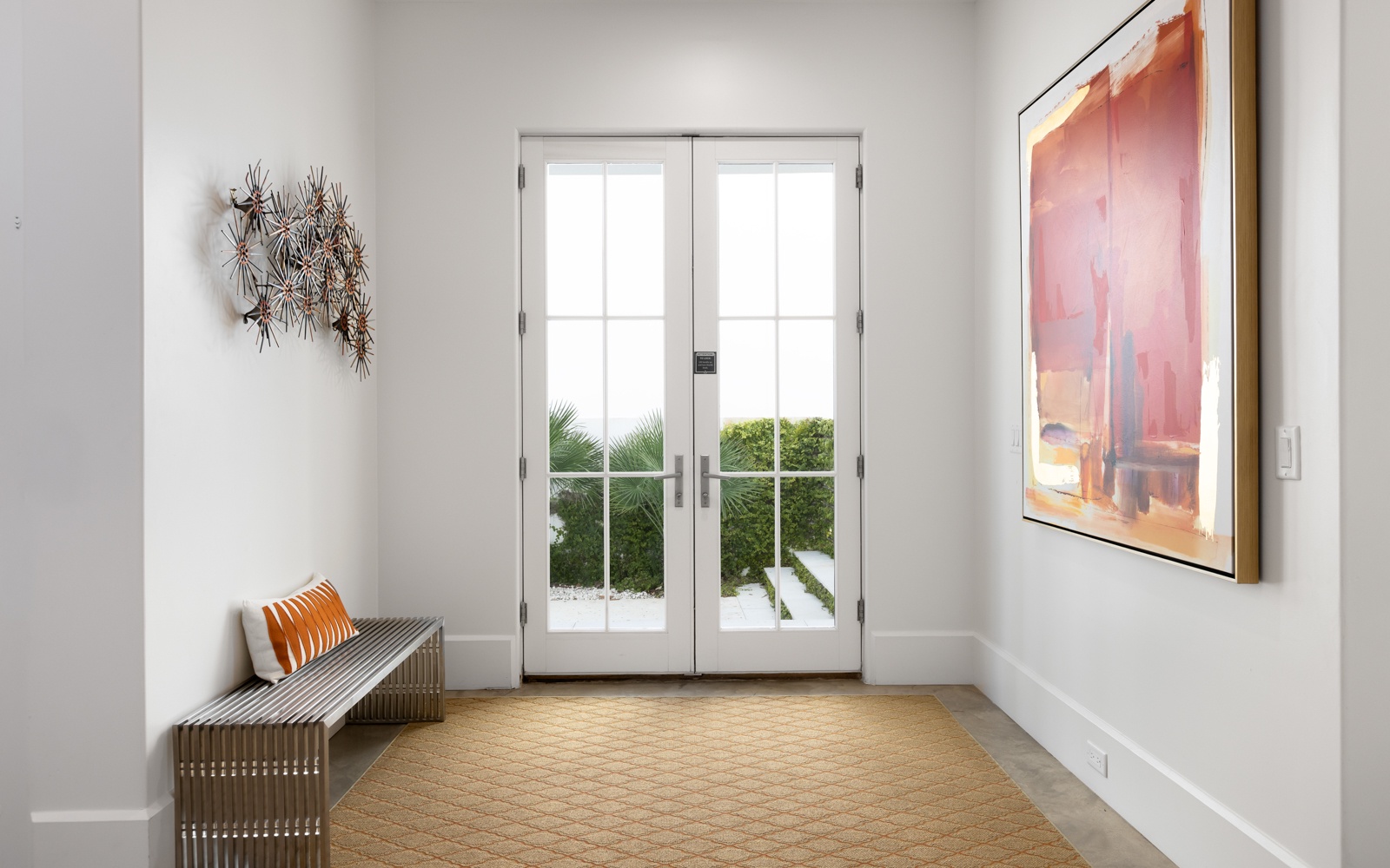 Step into your bright entryway where natural light fills the space and thoughtful art creates a welcoming atmosphere for your arrival.