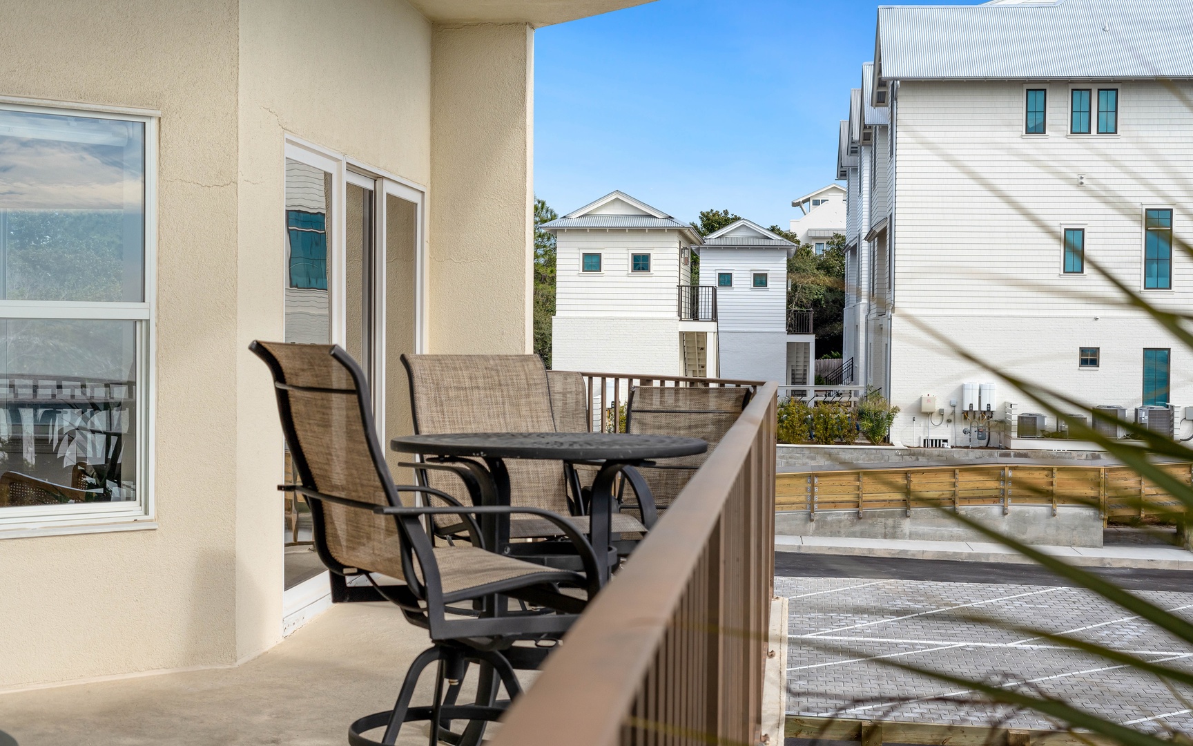 Step onto your private balcony and enjoy morning coffee while taking in peaceful neighborhood views from your comfortable outdoor seating.