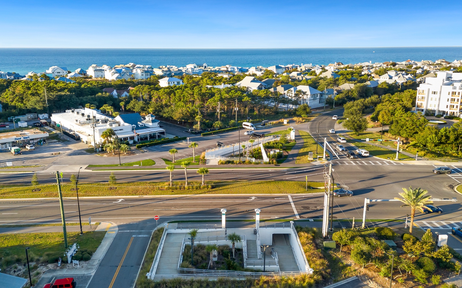 Coastal community nestled between lush greenery and ocean, featuring charming residential neighborhoods and convenient beachside access.