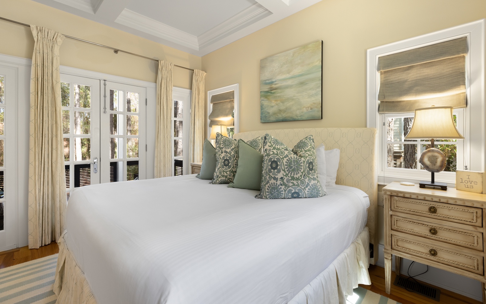 Sink into luxurious comfort with soft linens and elegant coastal touches creating your perfect retreat.