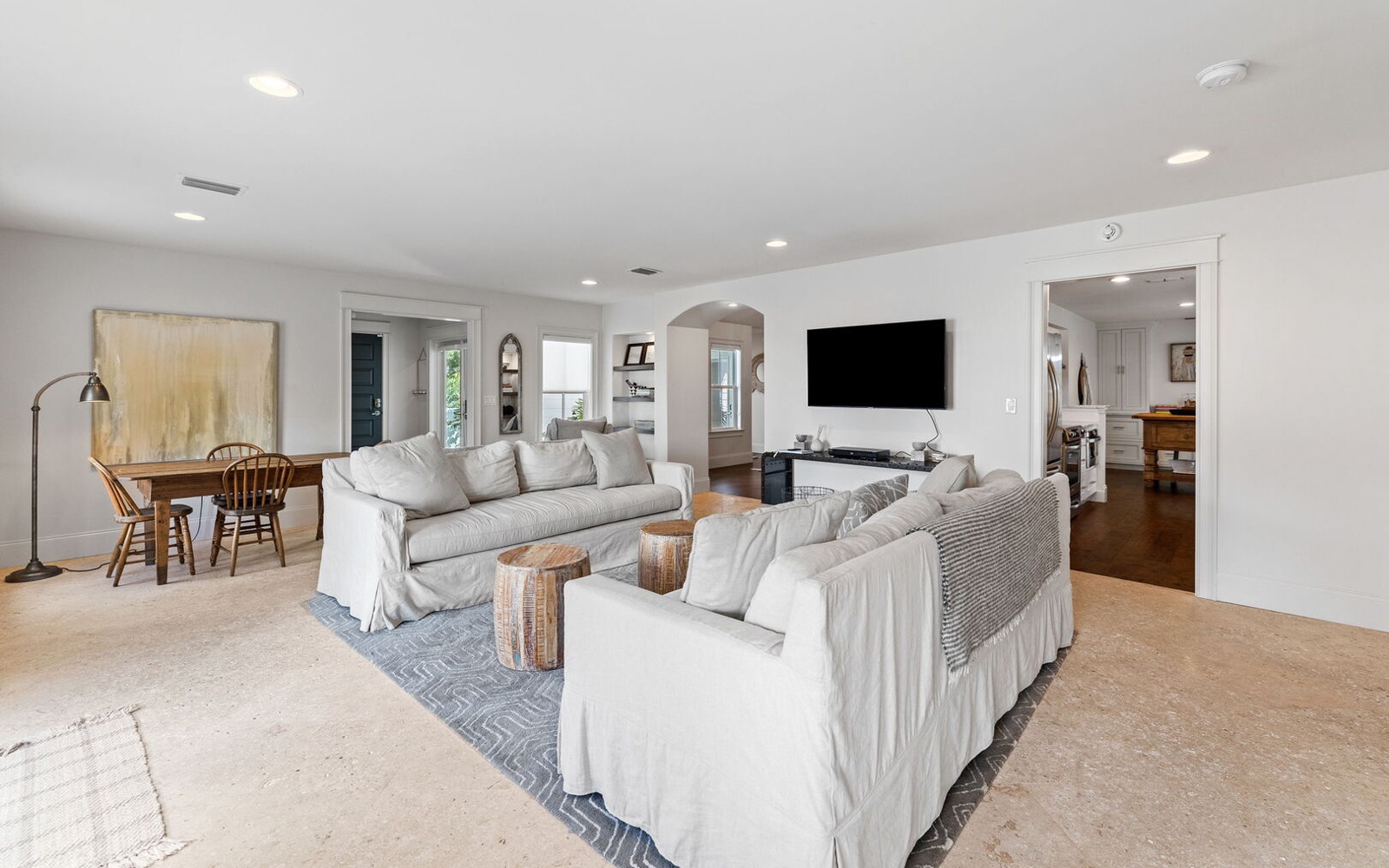 Sink into plush sofas in your bright, open living space where comfort meets style—perfect for family movie nights.