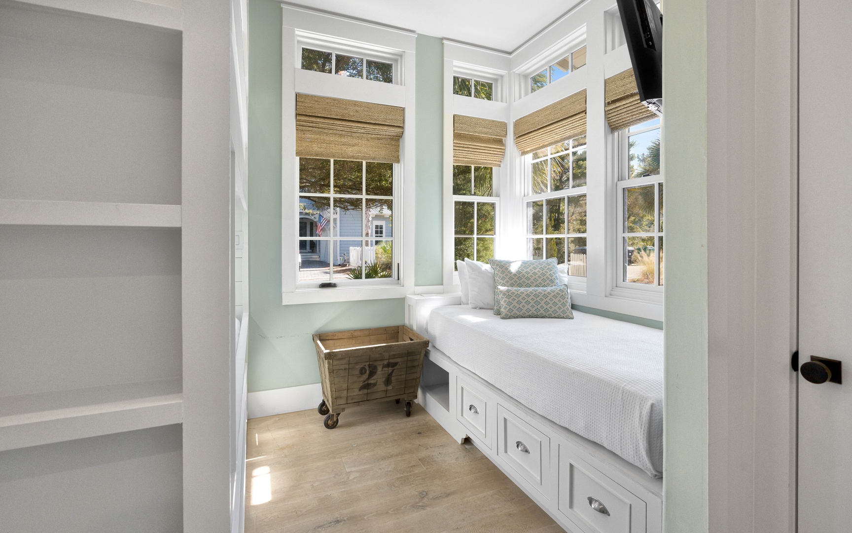 Curl up in your cozy window nook with soft cushions and built-in storage, perfect for morning coffee or afternoon reading sessions.