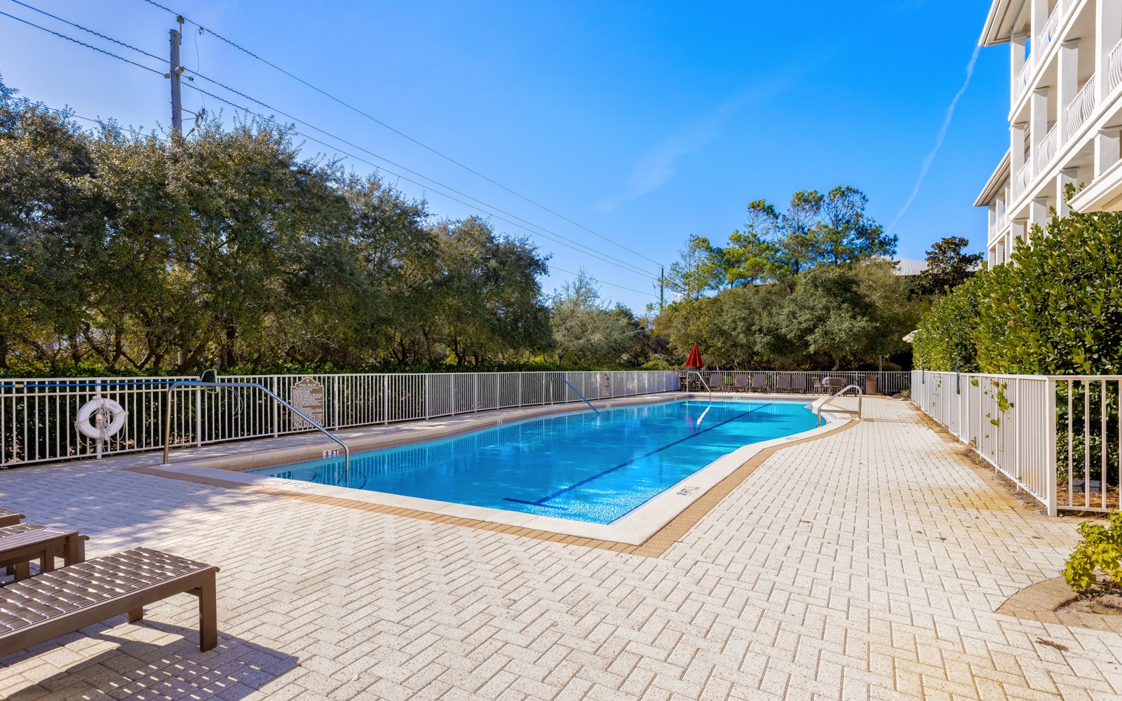 Sparkling pool surrounded by brick pavers creates your perfect spot for morning swims and sunny afternoon relaxation.
