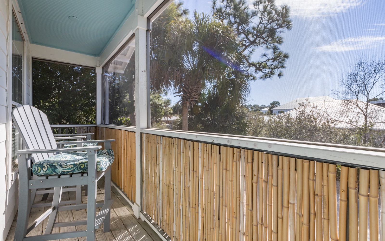 Step onto your private balcony and breathe in the tropical air. Bamboo railings frame leafy views while comfortable seating awaits your morning coffee moments.