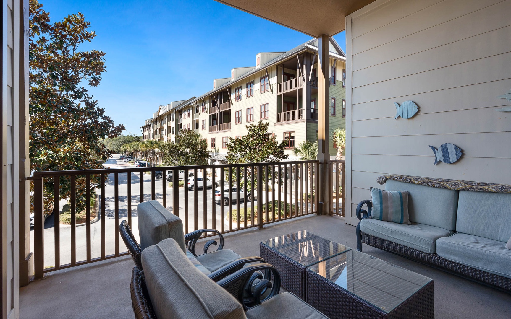 Your private balcony offers comfortable seating and peaceful views of the resort grounds.