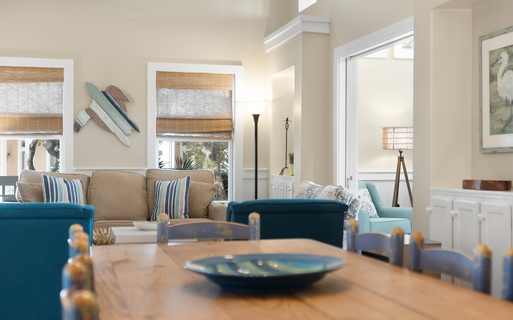 Relax in your bright, airy living space where coastal blues meet warm neutrals, creating the perfect atmosphere for peaceful moments together.