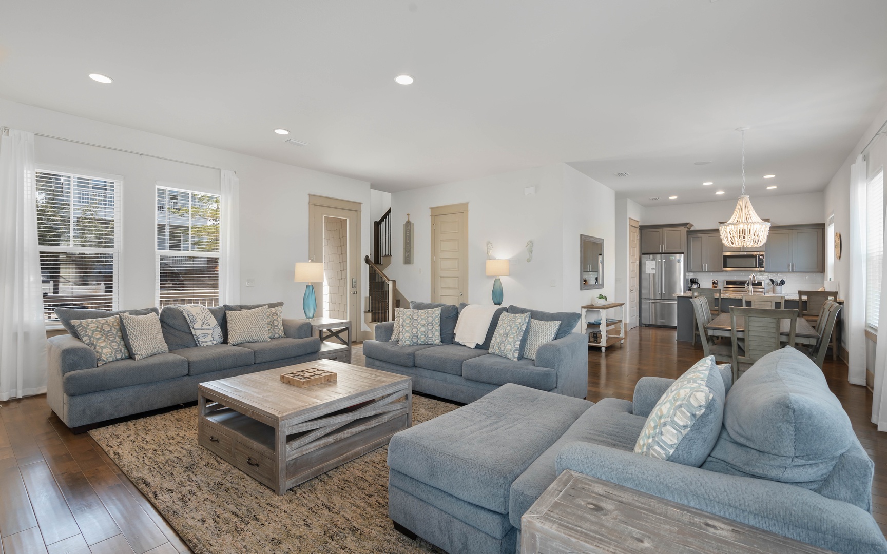 Relax in your spacious living room with plush seating and an open kitchen perfect for gathering with loved ones.
