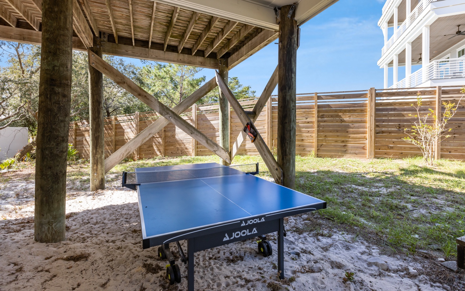 Enjoy friendly games under your own covered pavilion with professional table tennis setup in the private backyard.