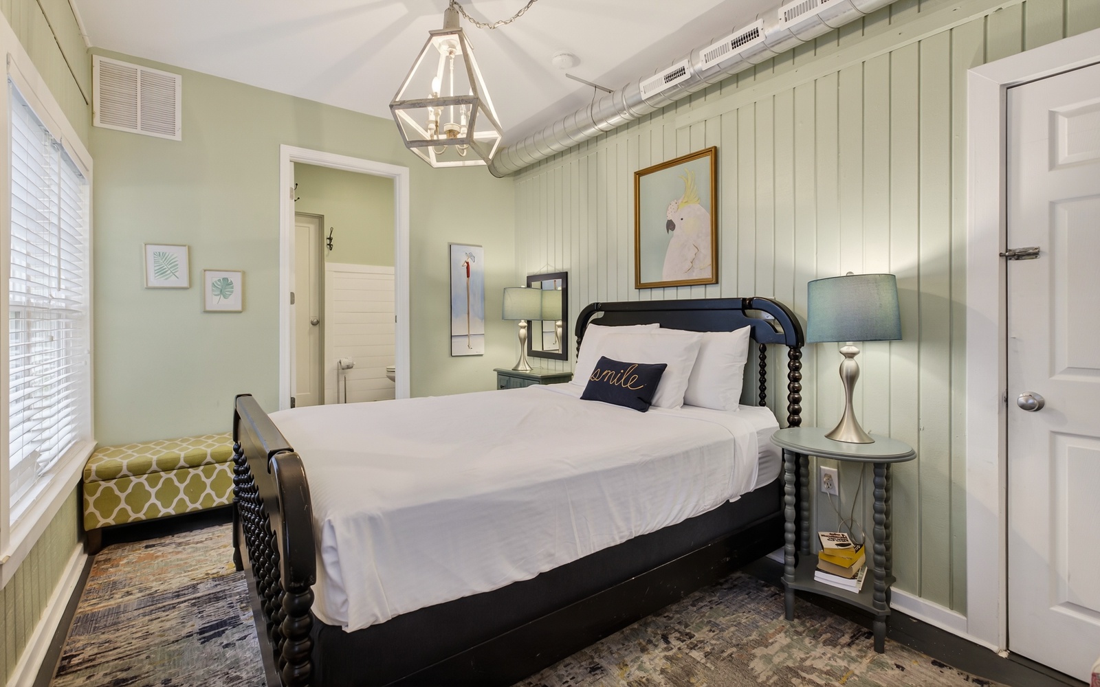 Unwind in your charming bedroom with crisp linens, warm lighting, and coastal cottage vibes that invite peaceful rest.