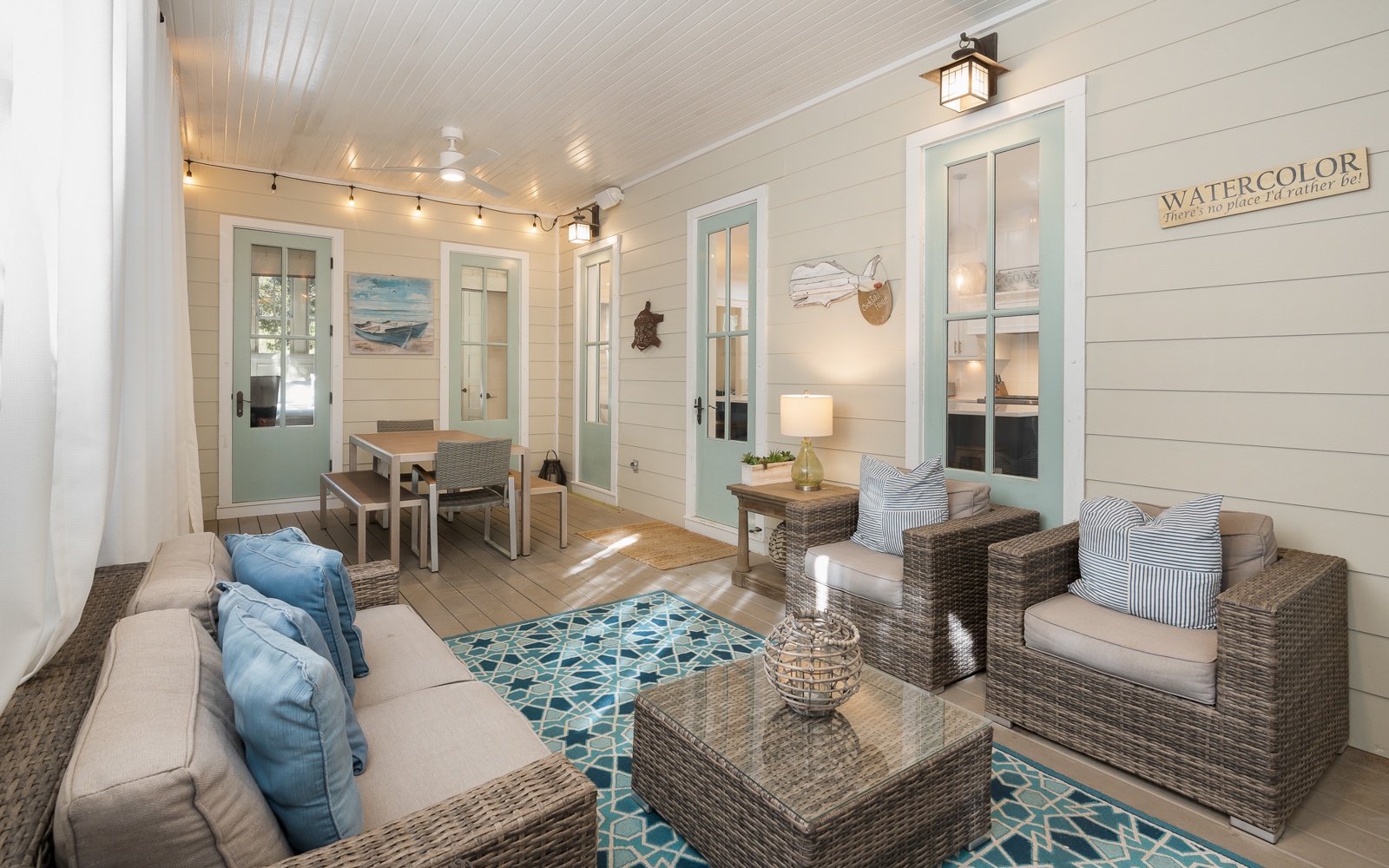 Unwind in your bright, coastal living space with wicker seating and cheerful blue accents that perfectly capture beach house charm.