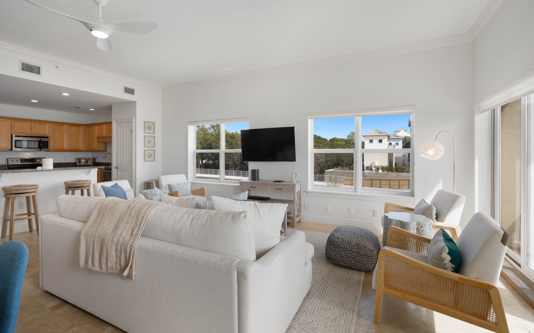 Sink into plush seating while enjoying your favorite shows on the wall-mounted TV in this bright, open living space.