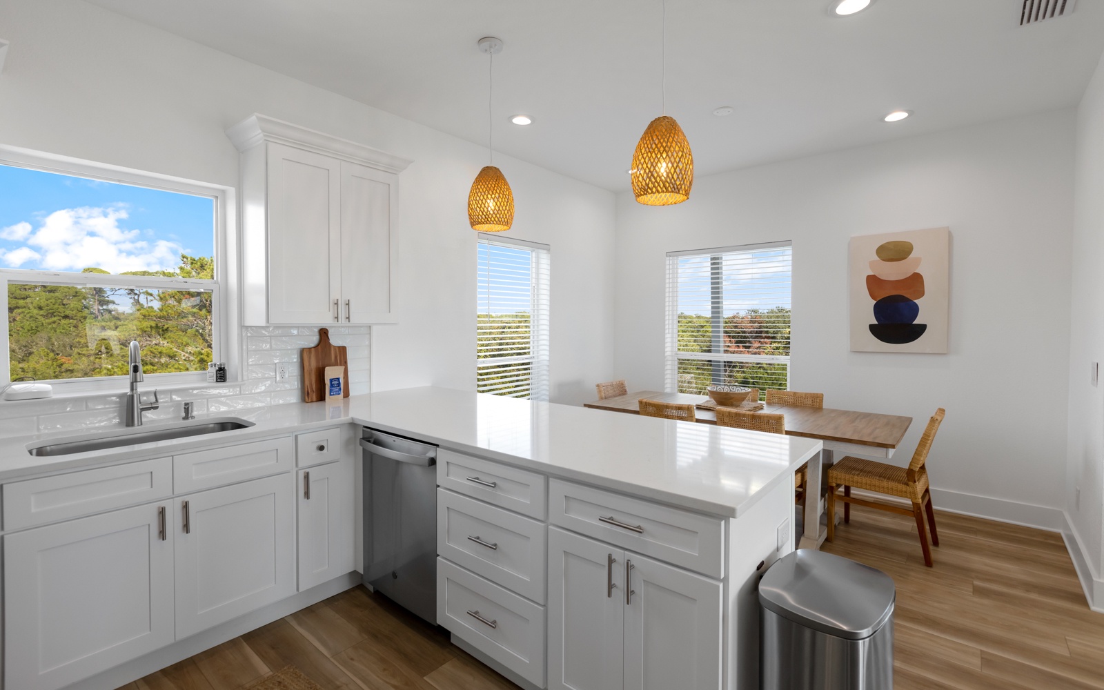 Your bright kitchen features modern appliances and a perfect dining nook where you'll enjoy morning coffee with nature views.