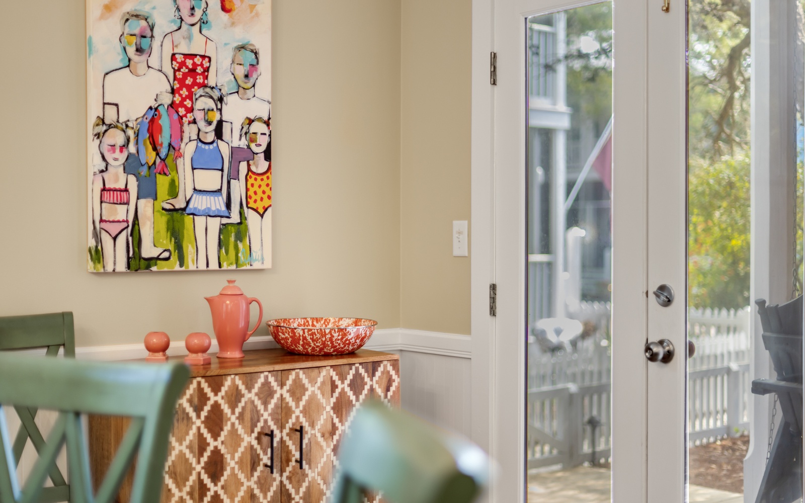 Bright dining space with colorful art and charming views invites you to enjoy meals in style.