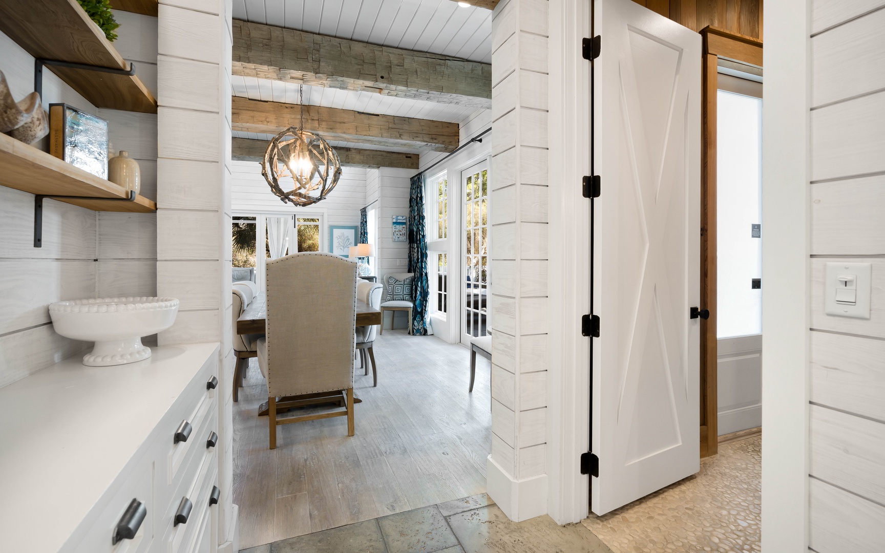 Step into your charming farmhouse kitchen where rustic wood beams and bright white cabinetry create the perfect blend of comfort and style.