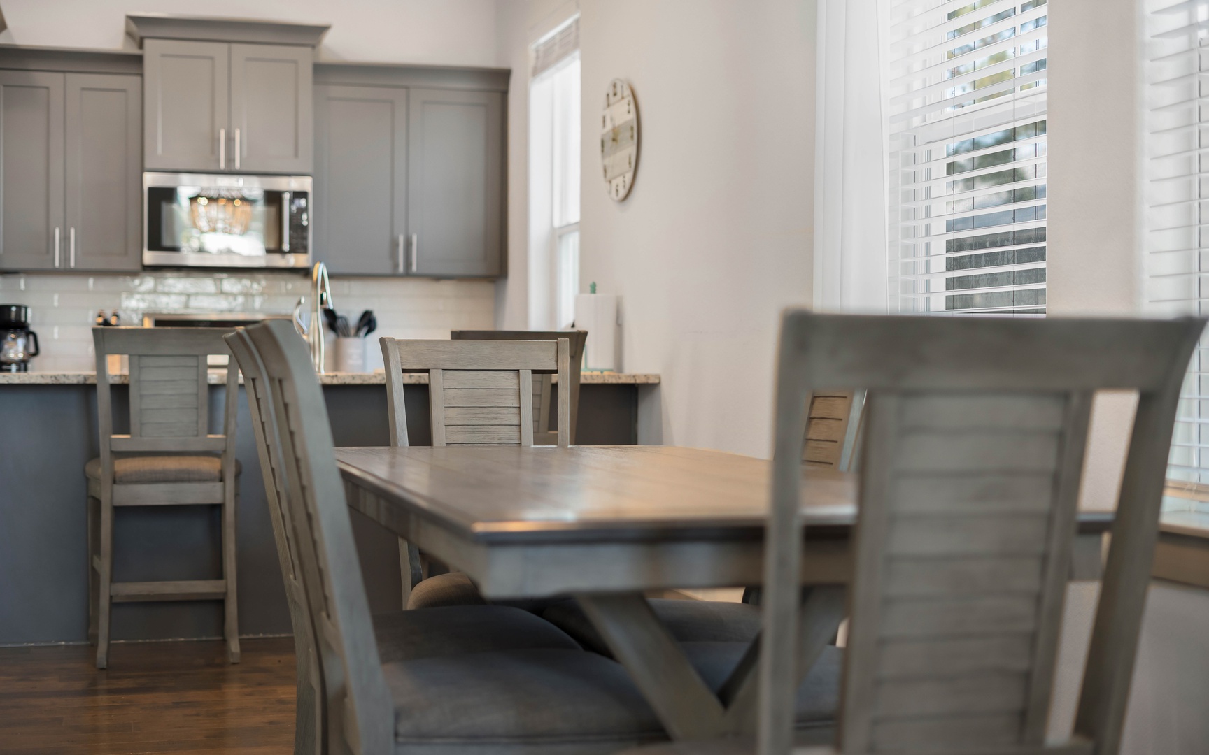 Gather around this beautiful dining table where morning coffee flows into evening conversations in your fully equipped kitchen space.