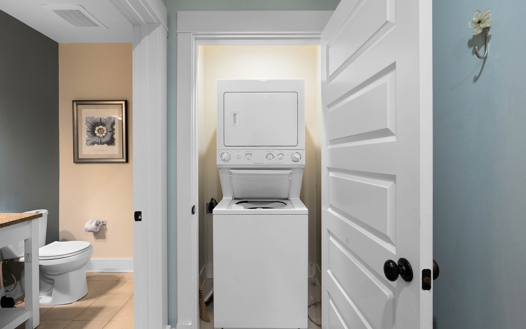 Your in-unit washer and dryer make extended stays effortless, tucked conveniently in a dedicated closet next to the bathroom.
