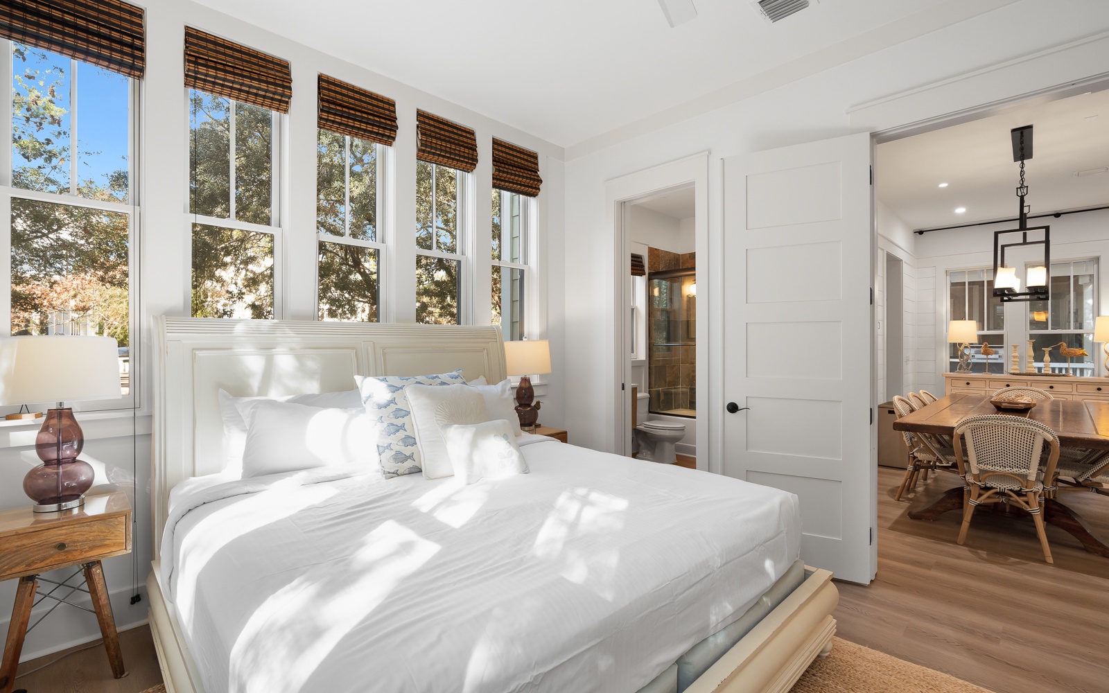 Wake up to gentle sunlight streaming through your windows, creating a serene sanctuary where crisp white linens invite peaceful mornings.
