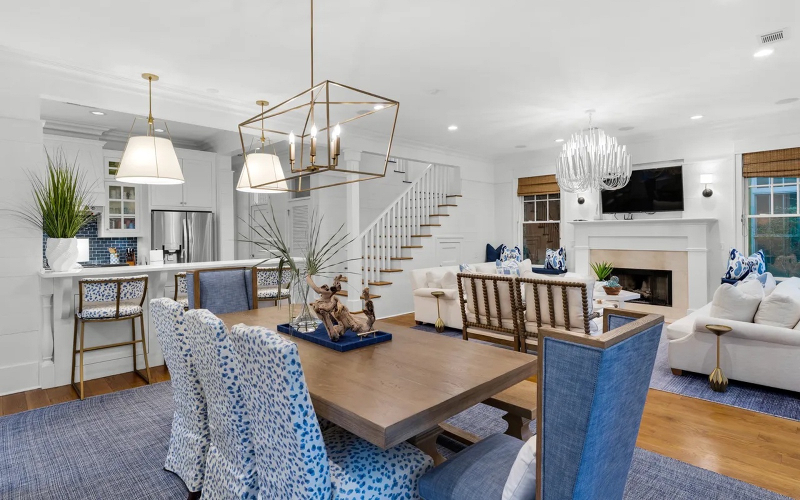 Unwind in your elegant open-concept retreat, where coastal blues meet warm woods and natural light dances across designer fixtures.