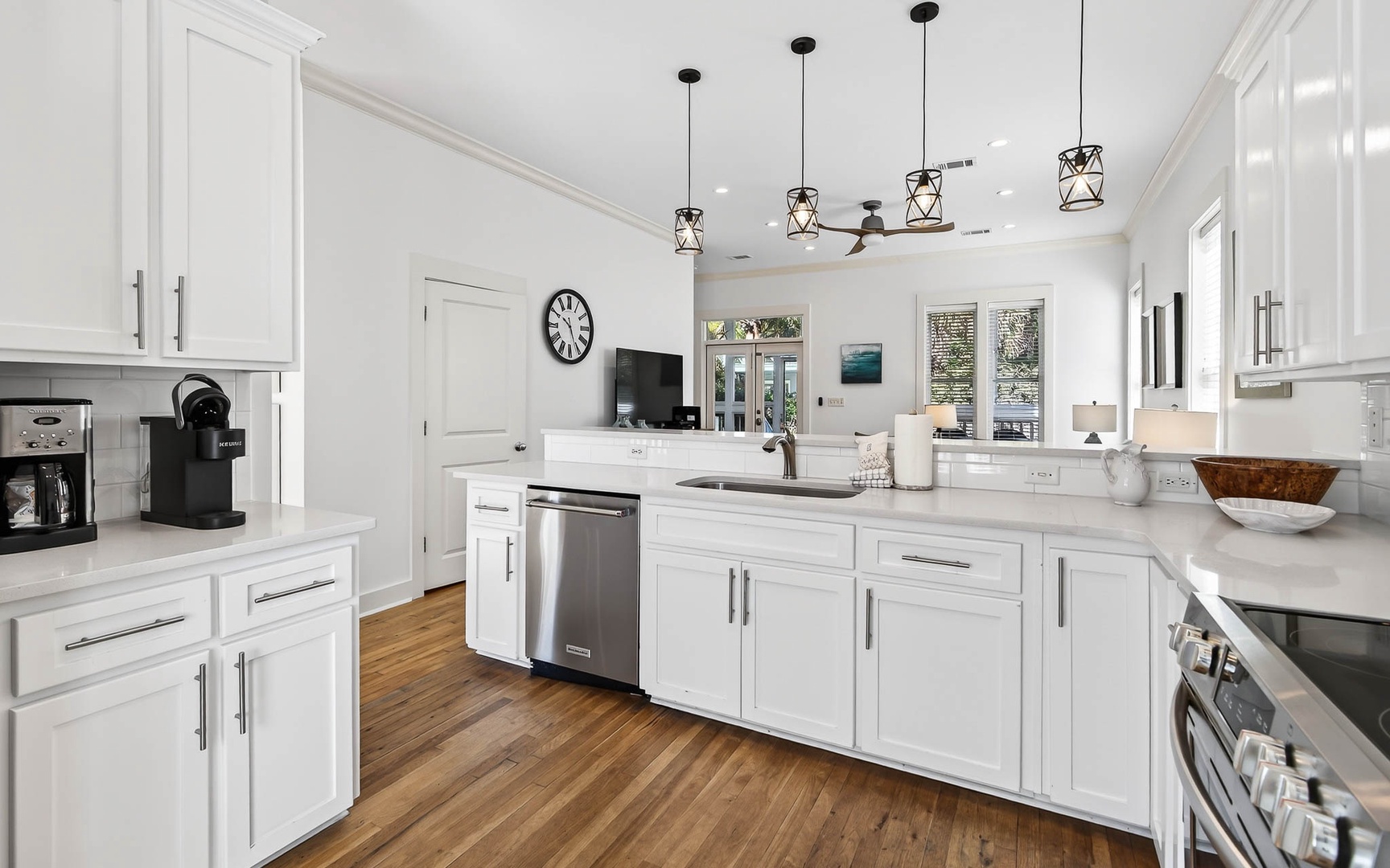 Your dream kitchen awaits with crisp white cabinetry, quartz countertops, and modern pendant lighting creating the perfect space for memorable meals.