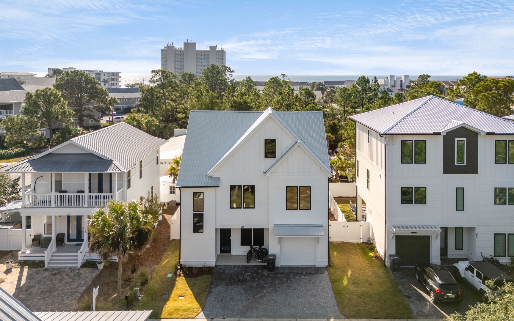 Modern coastal homes nestled in a charming neighborhood, offering peaceful residential surroundings with convenient city access nearby.