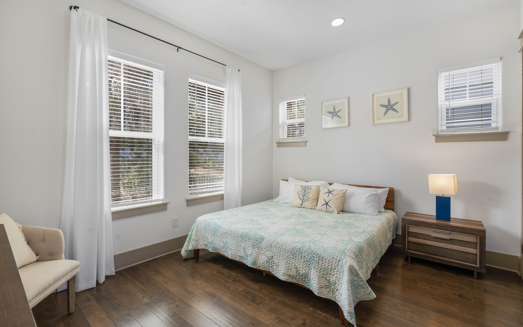 Drift off to sleep in your serene bedroom where coastal-inspired linens and nautical art create a peaceful retreat.