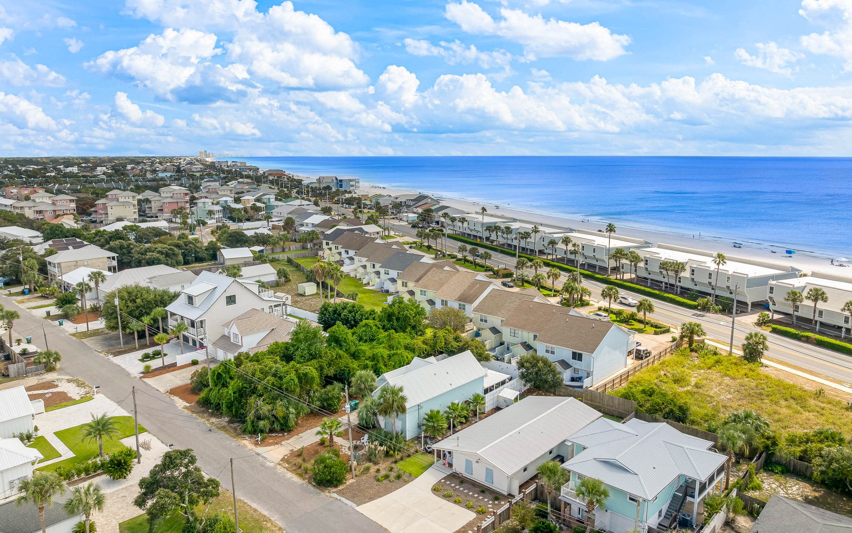 Coastal community featuring beachfront homes and pristine sandy shores along the Atlantic Ocean.