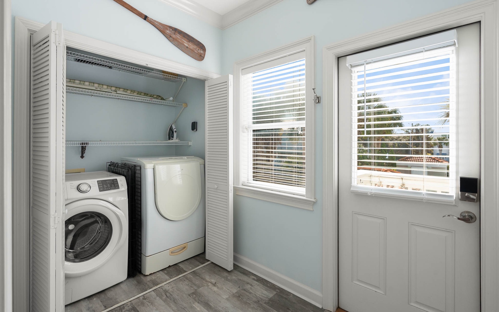 Your dedicated laundry space features full-size washer and dryer with organized storage shelving for effortless upkeep during your stay.