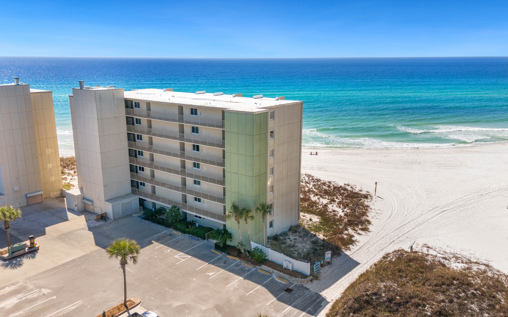 Beachfront property offering direct access to pristine white sand and crystal-clear Gulf waters.