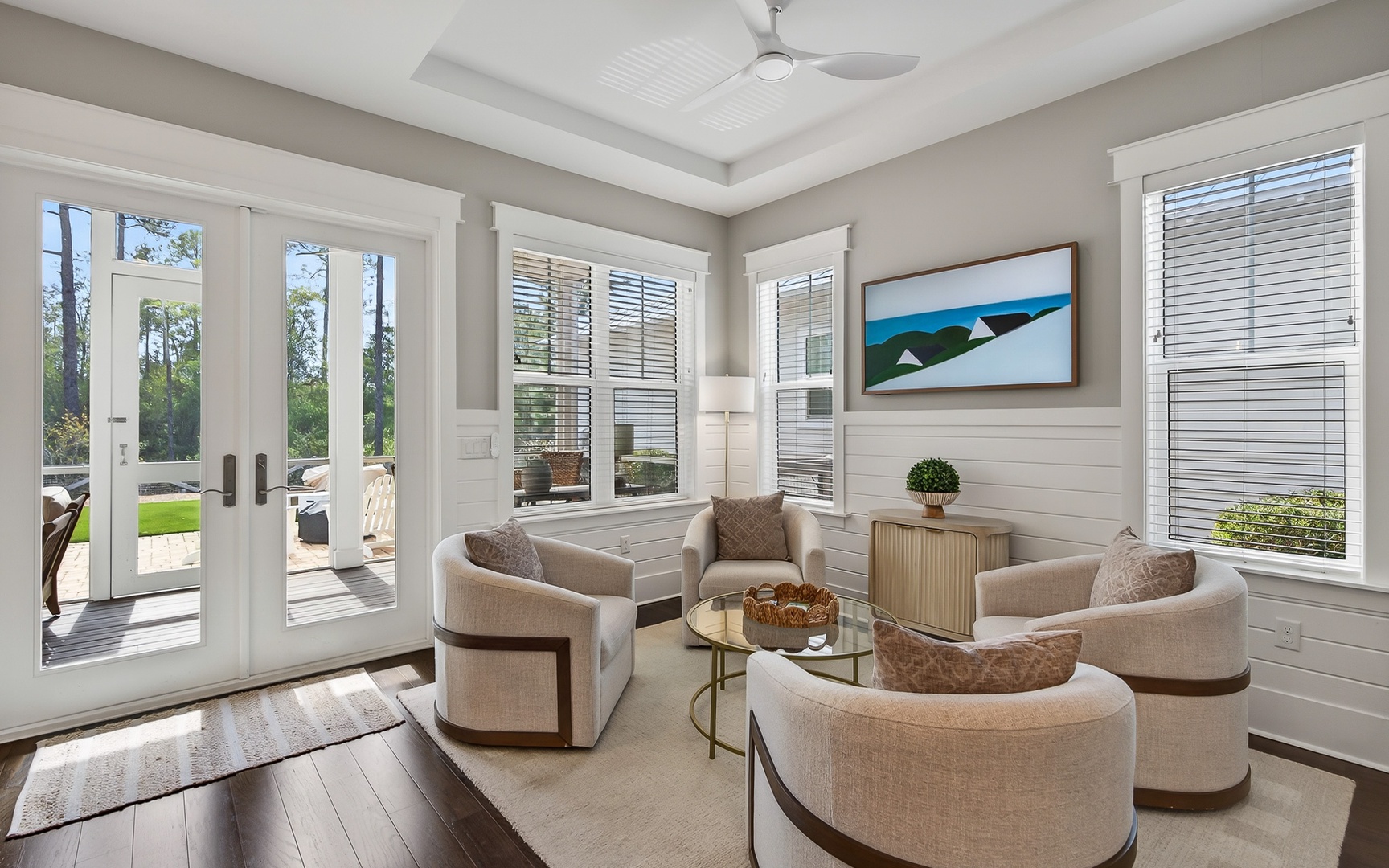 Sink into plush seating where natural light flows through elegant windows, creating your perfect retreat for morning coffee or evening conversations.