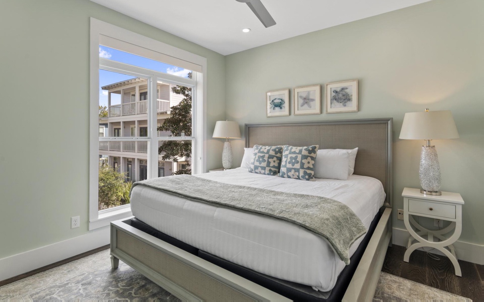 Sink into your plush bed surrounded by calming coastal colors and soft natural light streaming through your window.