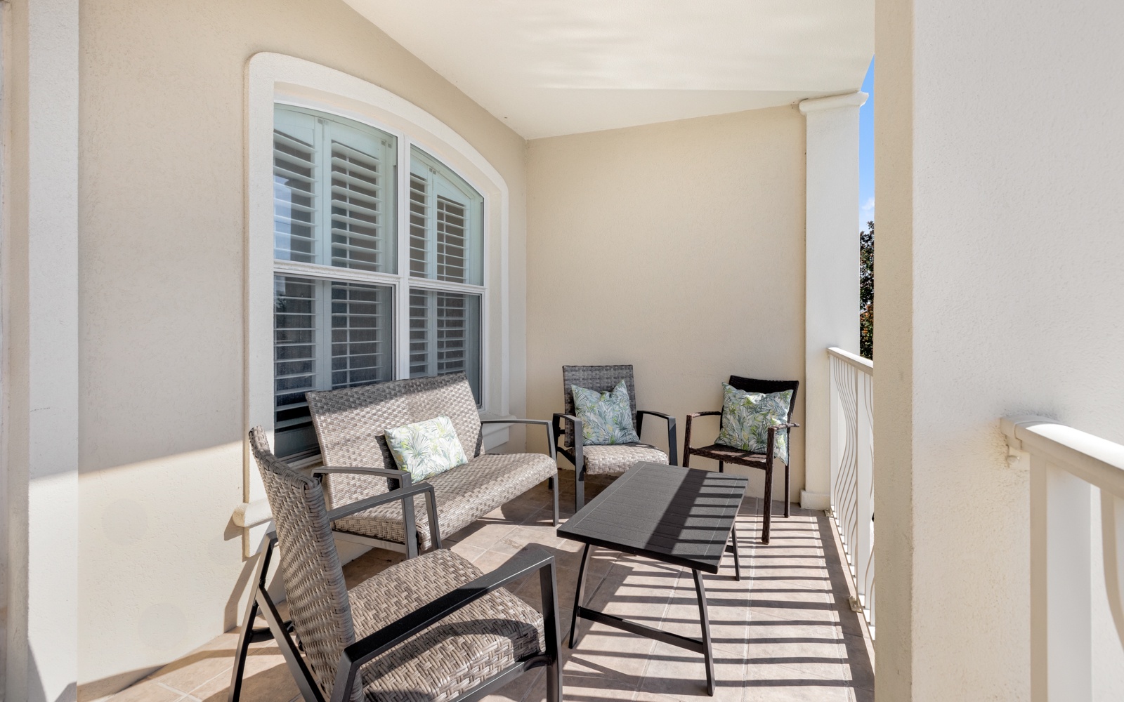 Your private covered terrace offers comfortable seating where you can unwind with morning coffee or evening conversations in peaceful seclusion.