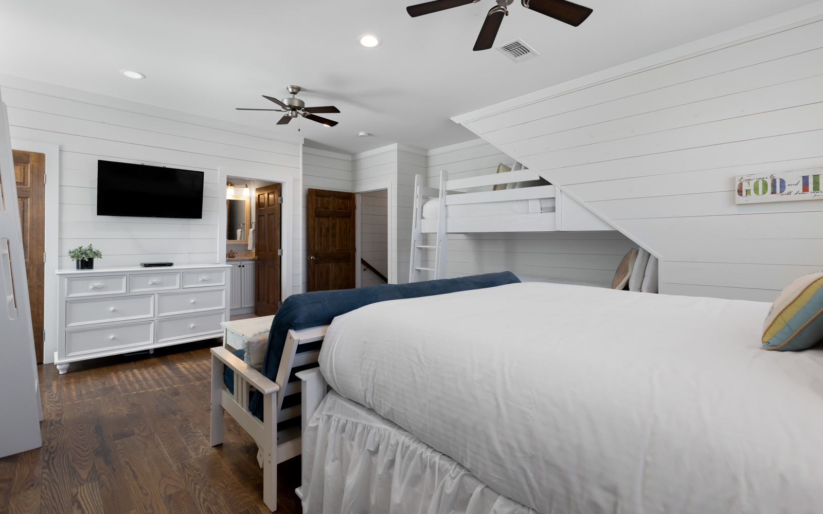 Unwind in your bright bedroom with crisp linens, modern amenities, and fun bunk beds—perfect for family adventures.