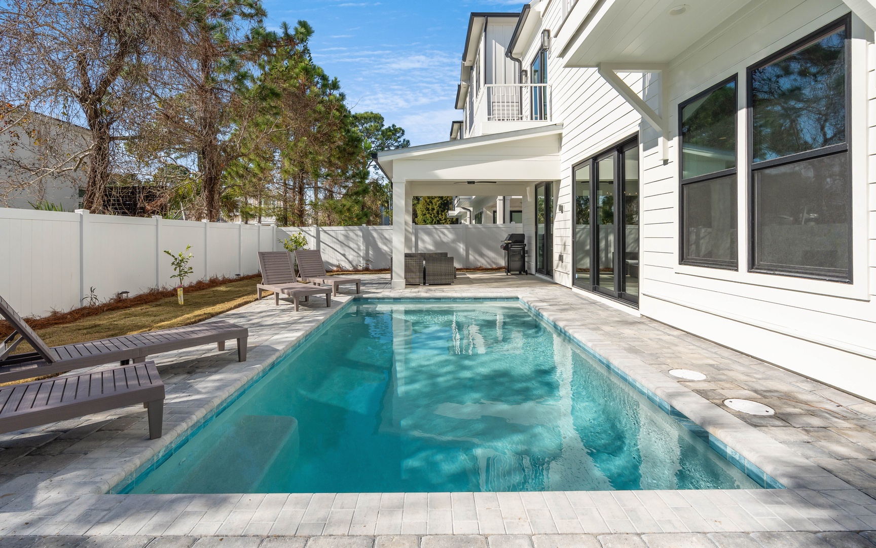 Your private pool oasis awaits with crystal-clear water and poolside loungers for ultimate relaxation.
