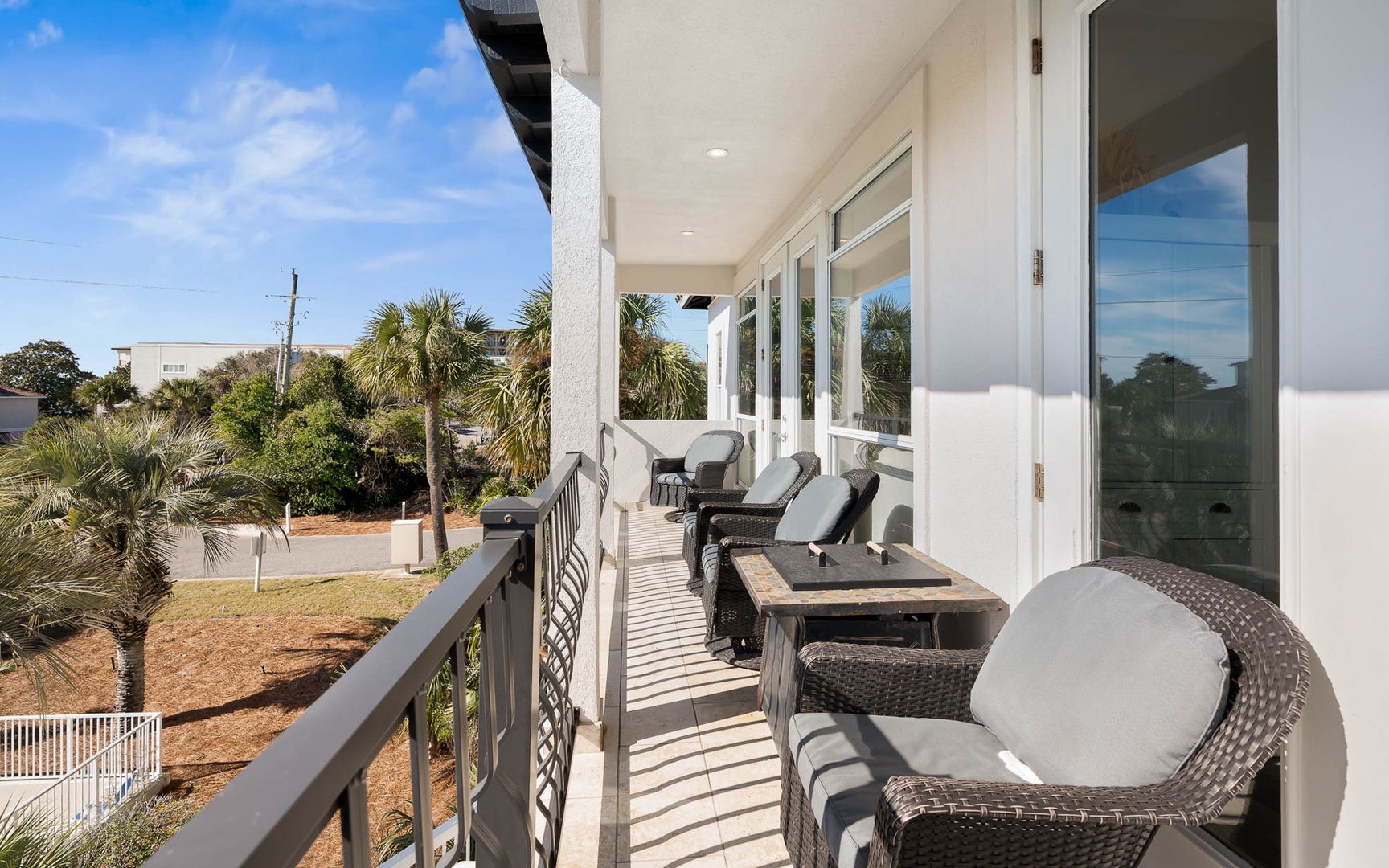 Relax on your private balcony with comfortable seating and dining space, perfect for morning coffee or evening meals.