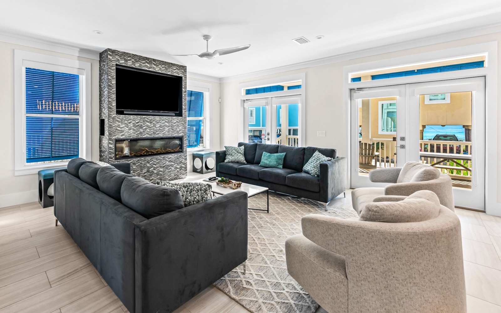 Sink into plush seating while the modern fireplace creates warmth and the large TV keeps you entertained during cozy evenings.