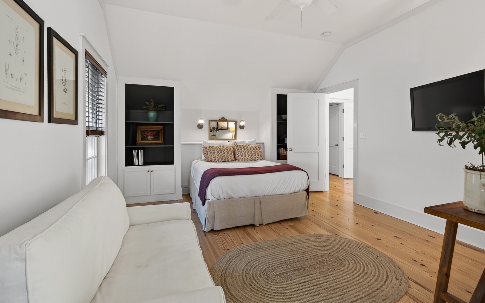 Relax in your bright bedroom suite with built-in storage, comfortable seating, and beautiful hardwood floors.