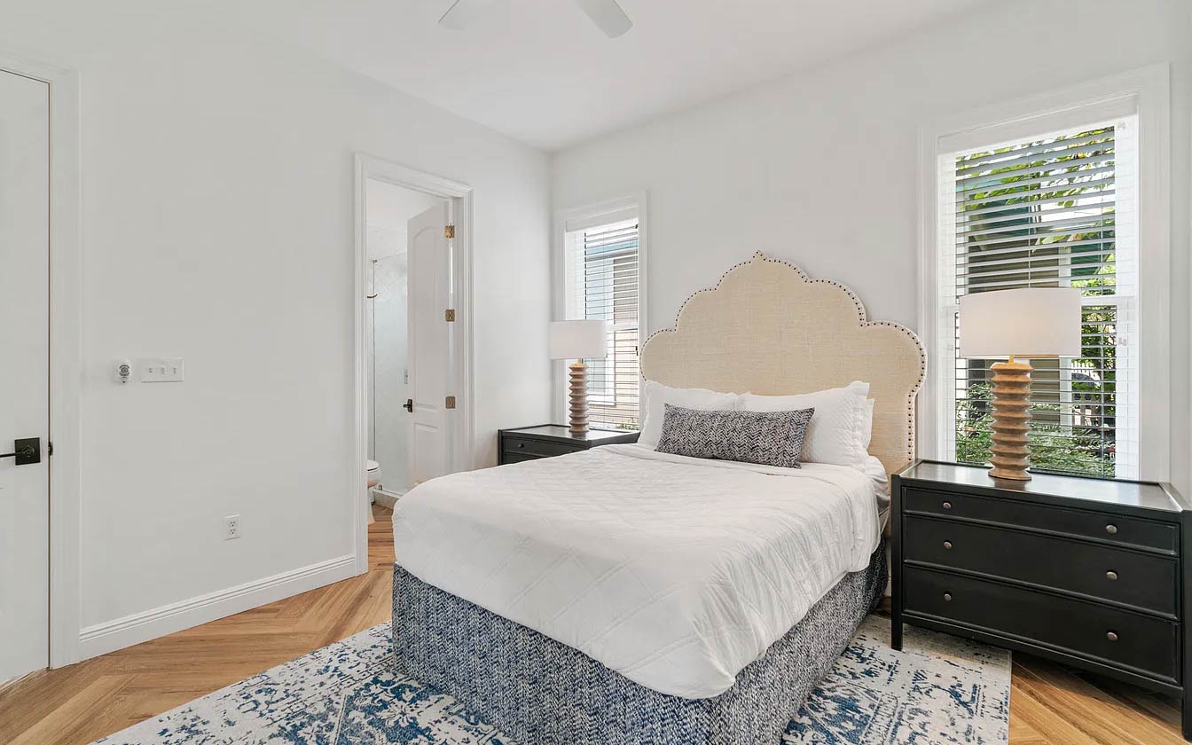 Drift off to peaceful sleep in your bright, airy bedroom featuring crisp linens and thoughtful touches that make every night restorative.