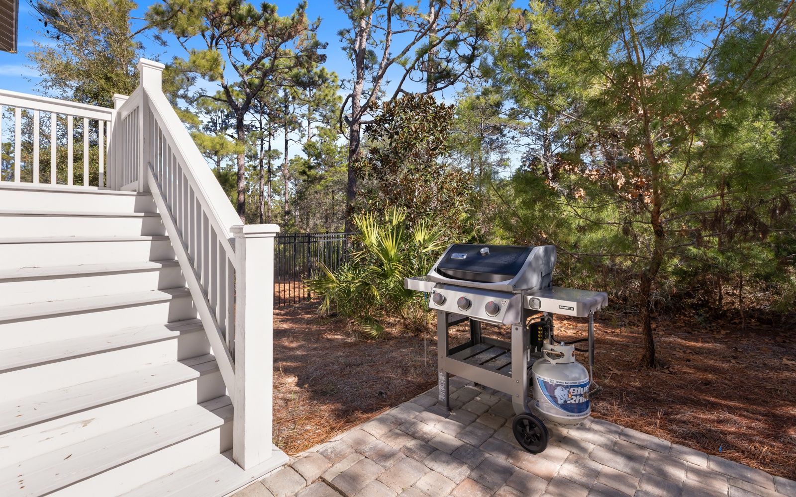 Fire up the grill and savor outdoor cooking surrounded by lush coastal pines, just steps from your deck.