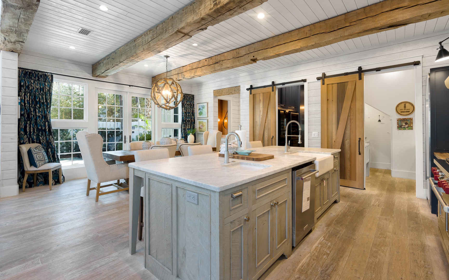 Cook and gather in your rustic-chic kitchen where exposed beams meet modern appliances, perfect for creating memorable meals together.