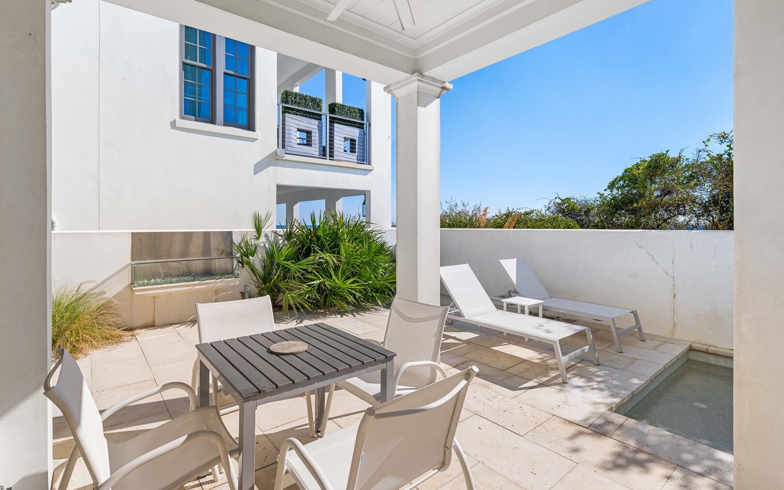 Your private terrace offers a peaceful retreat with dining space and loungers overlooking a sparkling plunge pool.