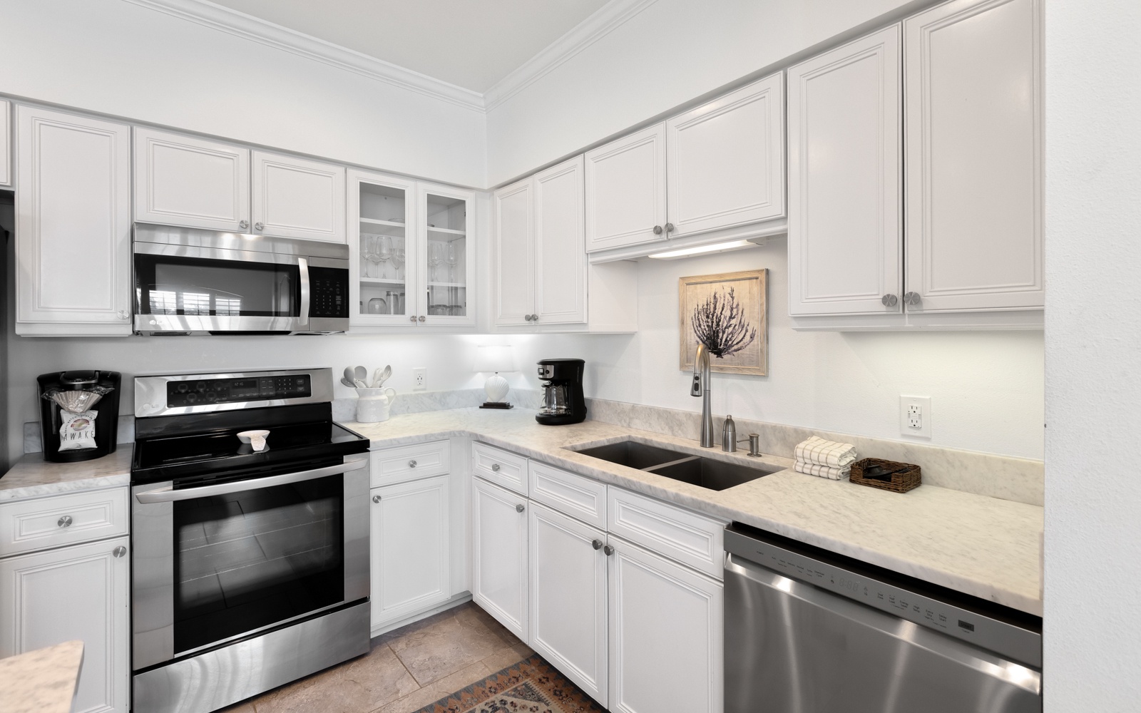 Your bright, fully-equipped kitchen awaits with granite counters, stainless appliances, and everything you need to prepare meals during your stay.