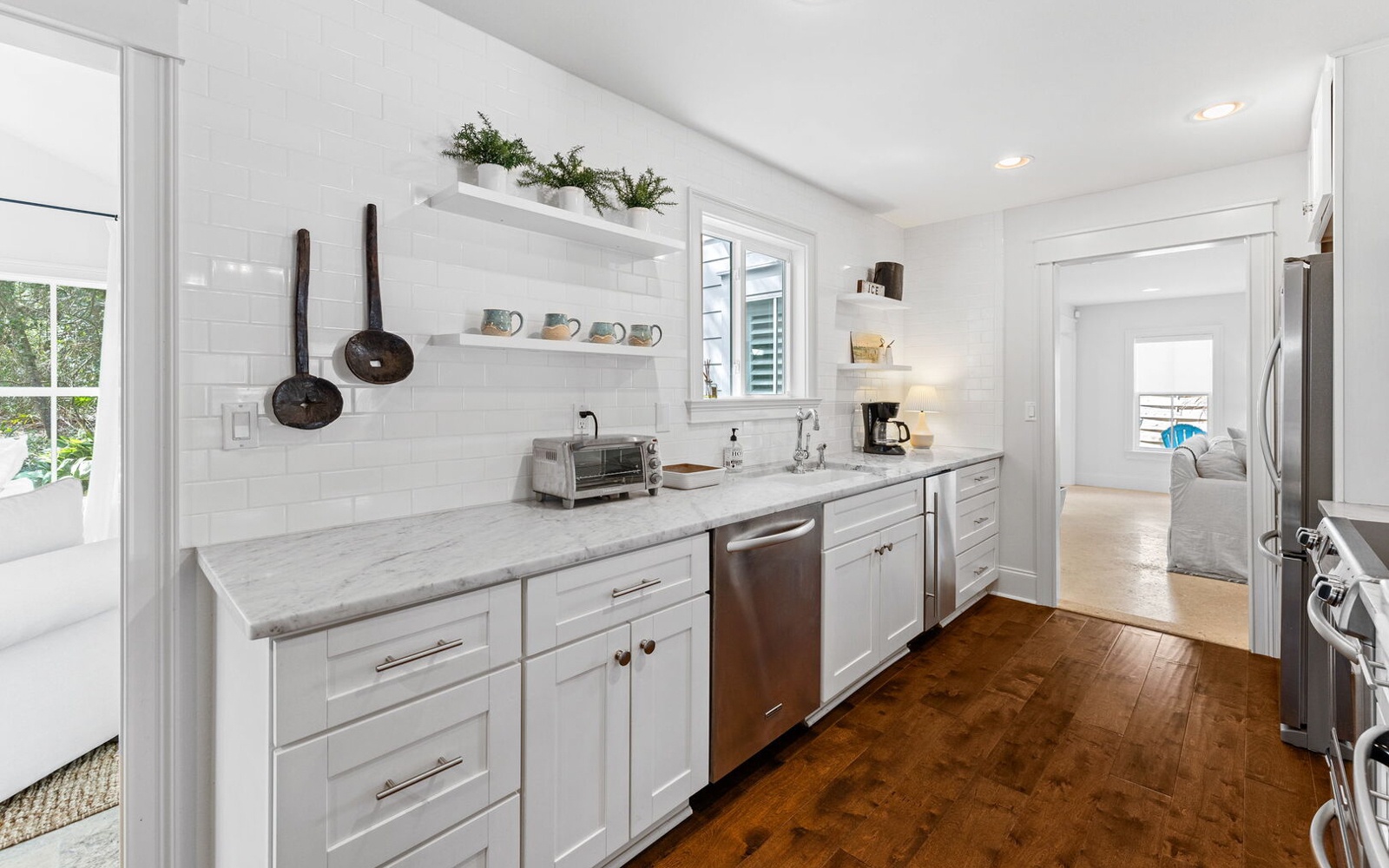 Your bright, fully-equipped kitchen awaits with marble counters, modern appliances, and charming touches for memorable meal prep.